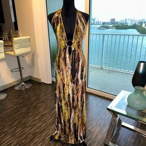 Halter, floor length dress with low cut back.